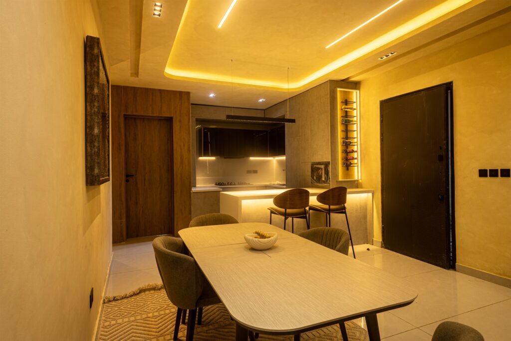 Brum Height 9: Dining table facing the open-plan living room and kitchen